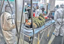 Pandemic : The Speculations Against China A Chinese COVID-19 patient being rushed into a Wuhan hospital