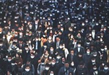 Medical Disaster : Coronavirus May Be Worse Than a Natural Disaster Mask-clad commuters during morning rush hour at the Shinagawa train station in Tokyo on 28 Feb 2020