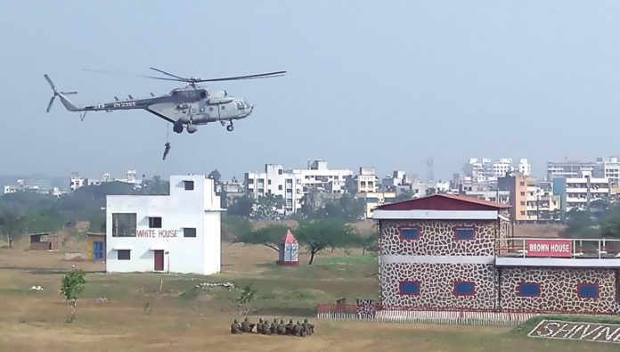 Indian and Sri Lankan soldiers practice repelling from helicopters during Ex Mitra Shakti VII at Aundh, Pune.