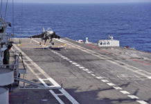 Navy Modernisation : Tejas Lands and Takes-off From Carrier Deck NP-2 a prototype of the naval variant of the Tejas light combat aircraft touching down for an _arrested landing_ on the deck of INS Vikramaditya, on 11 January 2020