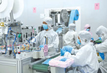 PANDEMIC: Global Backlash Building Against China Workers making surgical masks at a Foxconn factory in Shenzhen