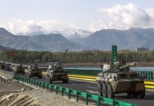 China talks peace but raises troop deployment People's Liberation Army vehicles being deployed on an exercise in the Tibet Autonomous Region