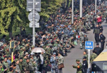 Troubles Mounting for Xi Inside China PLA veterans protesting over pension issues outside the military headquarters in Beijing, October 11, 2017.