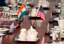 Editorial: Towards a Comprehensive Indo-US Strategic Partnership India-US flags at the delegation table