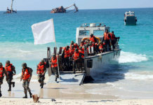 JOINT OPERATIONS – Tri-Services Joint Exercise AMPHEX 2021 Trained amphibious troops wade ashore from landing craft in the wet phase of the exercise