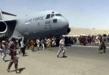 The Fall of Kabul 2021 Afghans desperate to be evacuated from Kabul follow a US C-17 Transport while it takes off.
