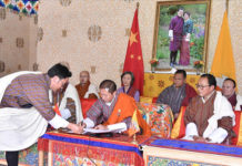 Bhutan, China Sign Pact on Border Talks Lyonpo TandiDorji, Bhutan’s foreign minister signing the MoU on border talks with China on 14 October 2021