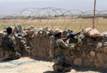 Pakistan troops, Taliban exchange fire along Durand Line as fencing continues Afghan police personnel keep watch near the Durand Line