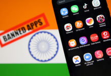 Indian Bans on Apps Hurts China Smartphone with Chinese applications is seen in front of a displayed Indian flag and a "Banned app" sign