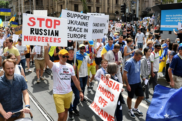 Protesters march in Melbourne, Australia against the Russian invasion of Ukraine, 26 Feb 2022