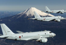 Pacifist Japan unveils unprecedented $320 bn military build-up Three JMSDF Kawasaki P-1 in flight with Mount Fuji in the background.