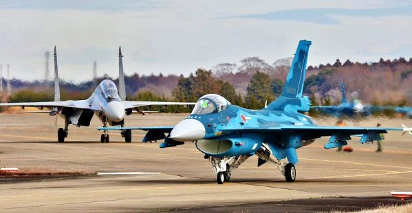 An IAF Su-30MKI with JSDF F-16 at Hyakuri Air Base, Japan