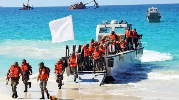 Troops wading ashore fropm Landing Crafts during Ex AMPHEX 2023