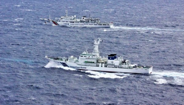 A Japanese Coast Guard patrol boat shadows a CCG vessel in Senkaku waters during a stand-off. (2)