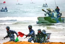 Developments in the South & East China Seas Chinese naval troops and amphibious armor advance ashore during an amphibious exercise.