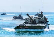 EDITORIAL—China’s War Plans Delayed Type 05 amphibious fighting vehicles of PLAs 73rd Group Army in Xiamen, Fujian, take part in amphibious assault exercises on May 12, 2021