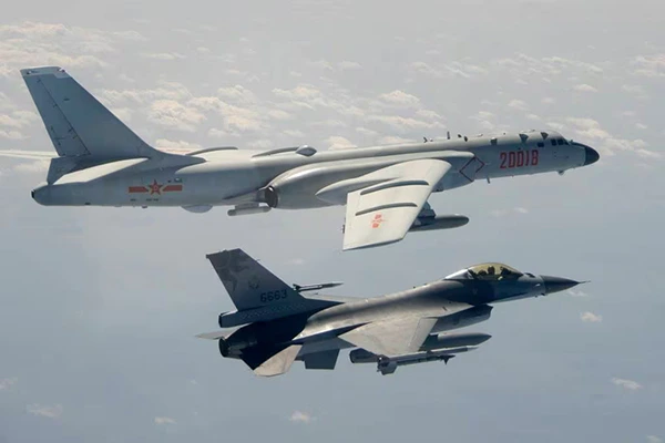 A-Taiwanese-Air-Force-F-16-in-foreground-flies-on-the-flank-of-a-Chinese-Peoples-Liberation-Army-Air-Force-H-6-bomber-as-it-passes-near-Taiwan-on-Feb.-10-2020