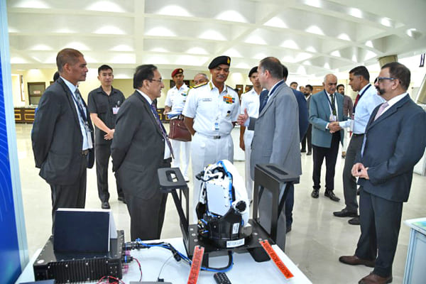 Admiral R Harikumar, Chief of the Naval Staff, being briefed at one of the exhibition stands