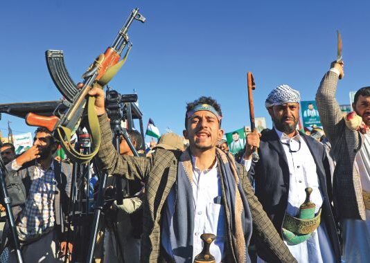 Houthi Strategy Against the US and Israel Armed Yemenis chant slogans during a march in solidarity with the people of Gaza on Nov 24, 2023, in the Houthi-controlled capital Sanaa.
